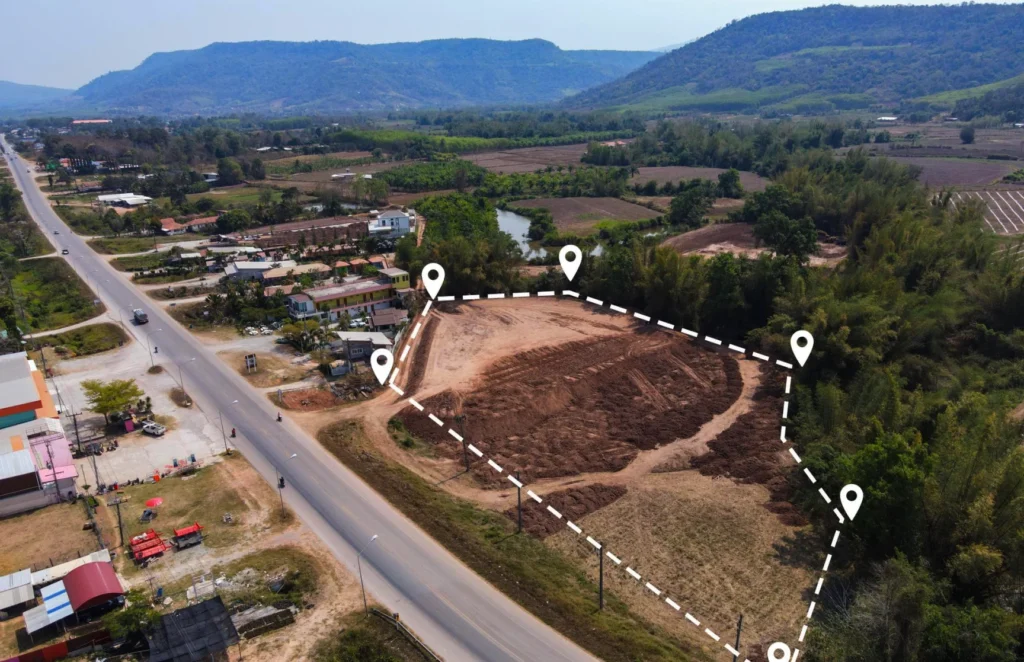 Aerial view of a large, undeveloped plot used for event site planning