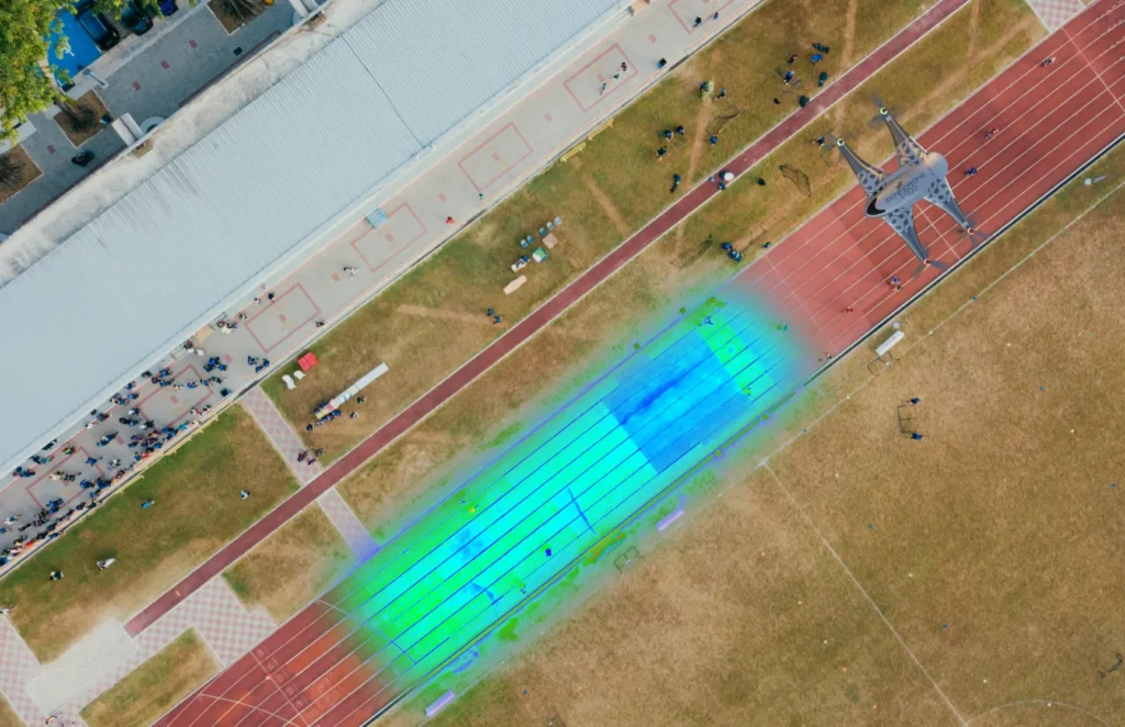 Drone capturing stadium track monitoring with a heat map overlay for analysis
