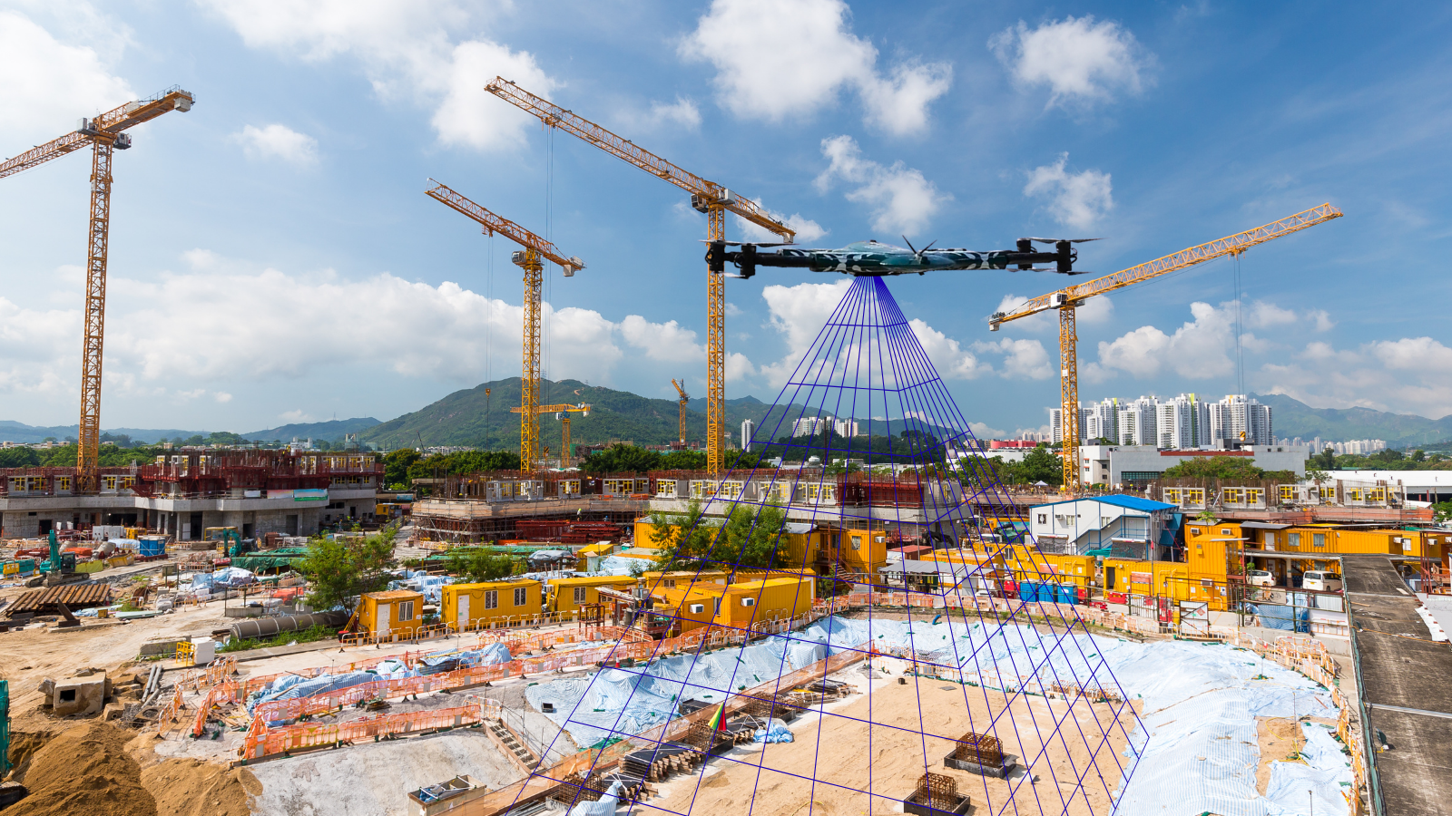 Drone surveillance monitoring construction progress using aerial mapping and real-time site inspection.